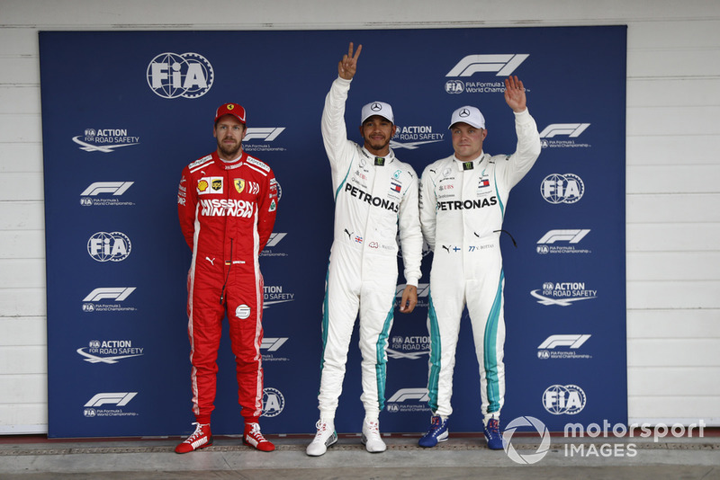 Top three Qualifiers, second placed Sebastian Vettel, Ferrari, pole man Lewis Hamilton, Mercedes AMG F1, and Valtteri Bottas, Mercedes AMG F1