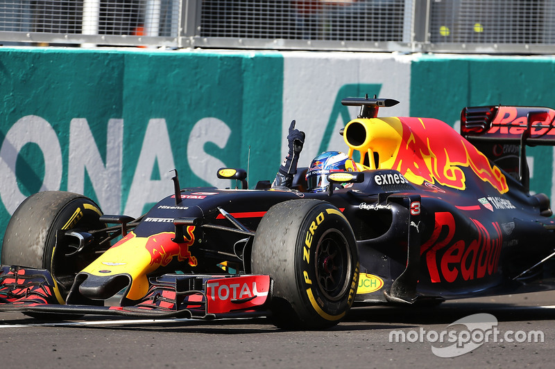 Race winner Daniel Ricciardo, Red Bull Racing RB12 celebrates as he takes the chequered flag at the end of the race