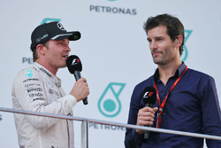 Nico Rosberg, Mercedes AMG F1 on the podium with Mark Webber, Porsche Team WEC Driver / Channel 4 Presenter