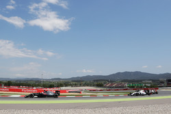 Fernando Alonso, McLaren MP4-31 leads Felipe Massa, Williams FW38 and Romain Grosjean, Haas F1 Team VF-16