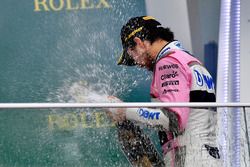 Third place Sergio Perez, Force India celebrates on the podium with the champagne