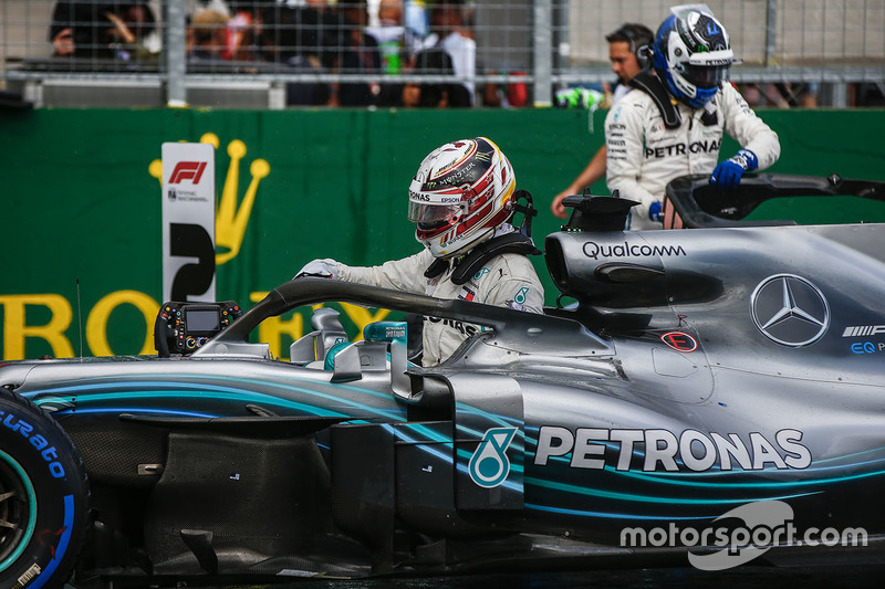 Lewis Hamilton, Mercedes AMG F1 climbs out of his car to celebrate pole position