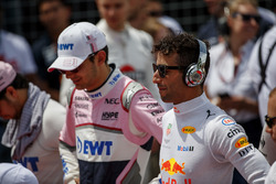 Esteban Ocon, Force India, and Daniel Ricciardo, Red Bull Racing, stand for the national anthem on t