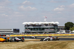 Romain Grosjean, Haas F1 Team VF-18, leads Marcus Ericsson, Sauber C37