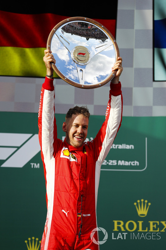 Sebastian Vettel, Ferrari, celebrates victory on the podium