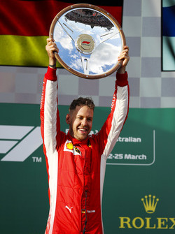 Sebastian Vettel, Ferrari, celebrates victory on the podium