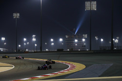 Pierre Gasly, Toro Rosso STR13 Honda, leads Kevin Magnussen, Haas F1 Team VF-18 Ferrari, and Esteban