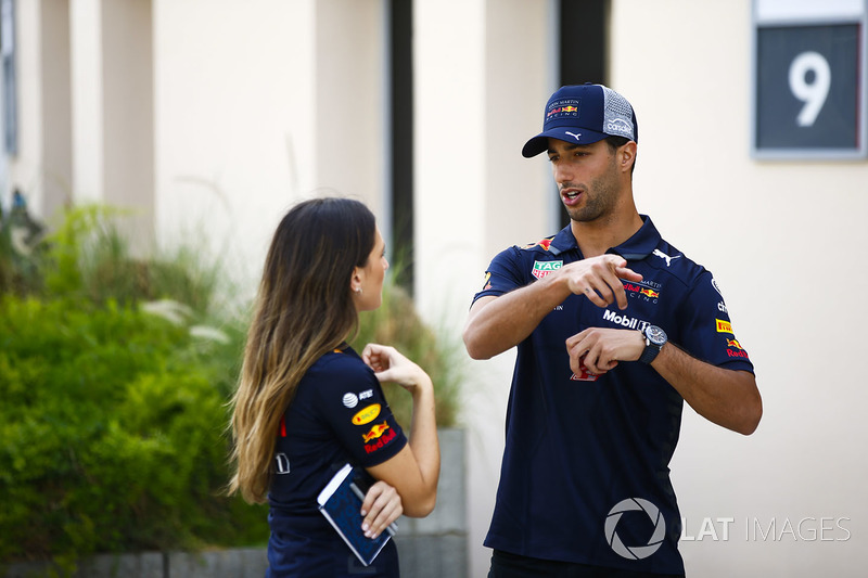 Daniel Ricciardo, Red Bull Racing, talks to a colleague