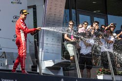 Sebastian Vettel, Ferrari celebrates on the podium with the champagne