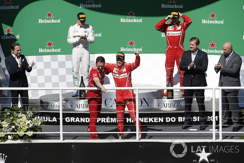 Race winner Sebastian Vettel, Ferrari celebrates on the podium with G. Vietina, Ferrari