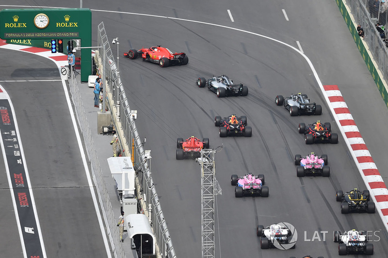 Sebastian Vettel, Ferrari SF71H leads at the start of the race