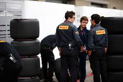 Pirelli engineers talk among some tyres