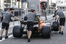 McLarem mechanics with McLaren MCL32 in pit lane