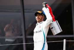 Lewis Hamilton, Mercedes AMG F1, 1st position, on the podium with his trophy