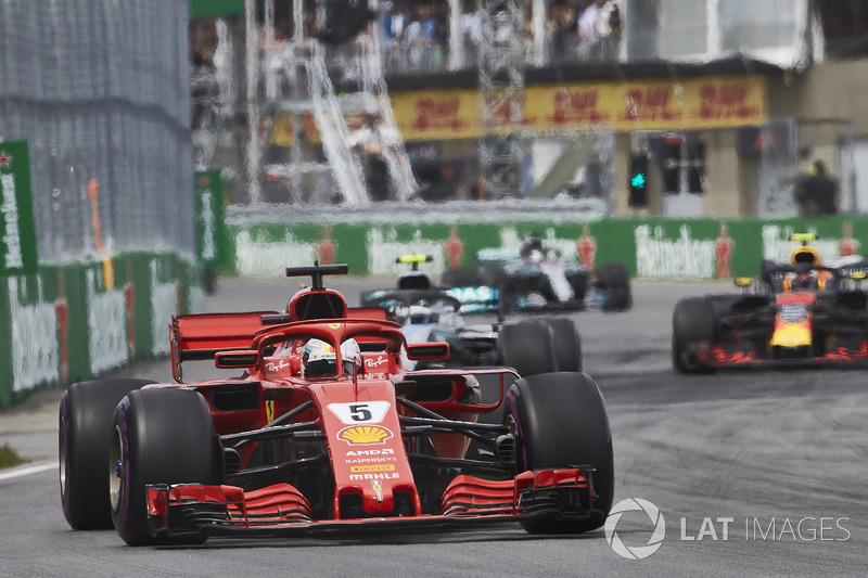 Sebastian Vettel, Ferrari SF71H, leads Valtteri Bottas, Mercedes AMG F1 W09