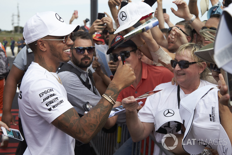 Lewis Hamilton, Mercedes AMG F1, signs autographs for fans