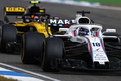 Lance Stroll, Williams FW41, leads Carlos Sainz Jr., Renault Sport F1 Team R.S. 18