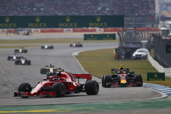 Kimi Raikkonen, Ferrari SF71H, leads Max Verstappen, Red Bull Racing RB14