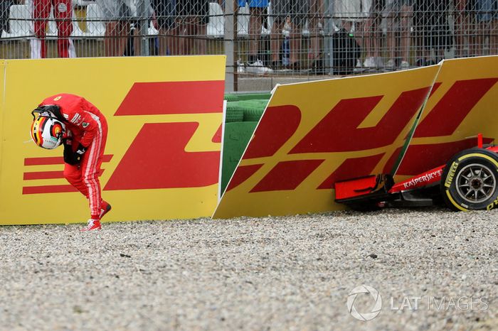 Sebastian Vettel, Ferrari SF71H walks in after crashing out of the race
