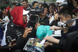 Lewis Hamilton, Mercedes AMG F1, signs autographs for fans