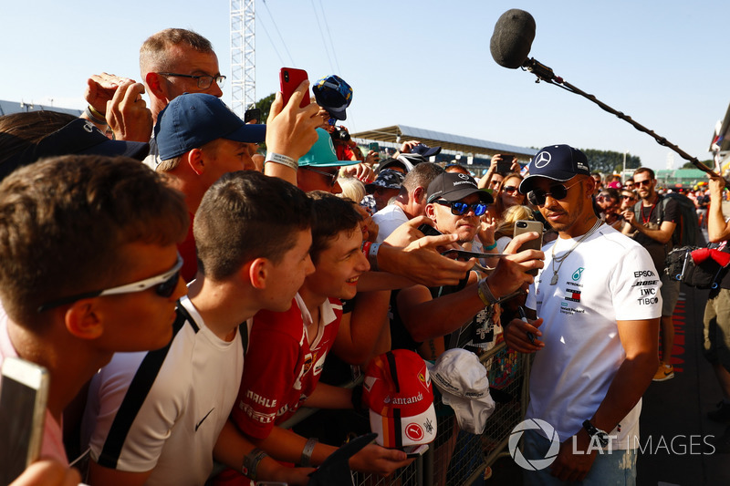 Lewis Hamilton, Mercedes AMG F1, signs autographs for fans