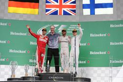 The podium (L to R): Sebastian Vettel, Ferrari, second; Lewis Hamilton, Mercedes AMG F1, race winner; Valtteri Bottas, Williams, third