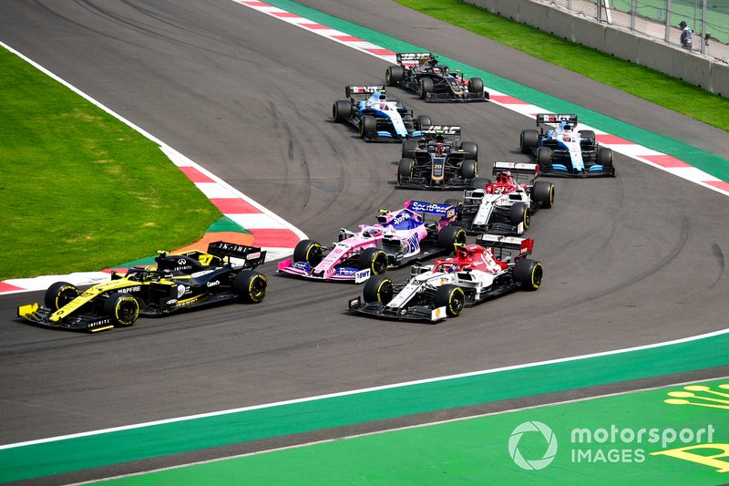 Nico Hulkenberg, Renault F1 Team R.S. 19, leads Antonio Giovinazzi, Alfa Romeo Racing C38, Lance Stroll, Racing Point RP19, Kimi Raikkonen, Alfa Romeo Racing C38, Kevin Magnussen, Haas F1 Team VF-19, George Russell, Williams Racing FW42, Robert Kubica, Williams FW42, and Romain Grosjean, Haas F1 Team VF-19, at the start