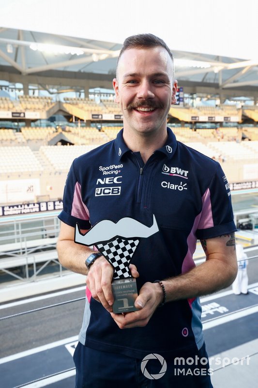 A Movember prize is awarded to a Racing Point team member