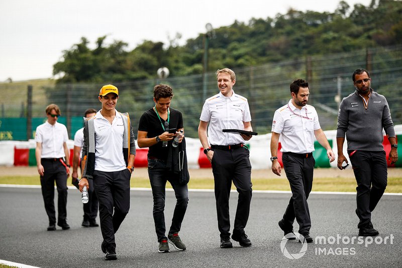 Lando Norris, McLarenwalks the track with Sacha Fenestraz