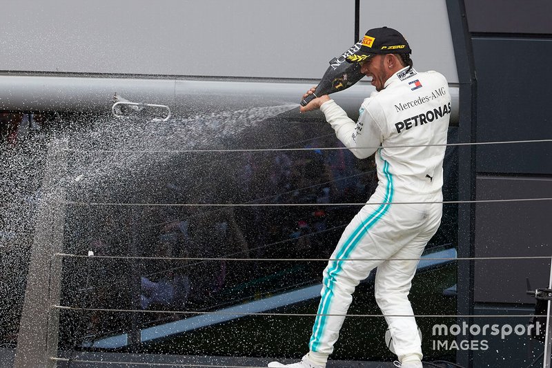 Lewis Hamilton, Mercedes AMG F1, 1st position, sprays Champagne from the podium