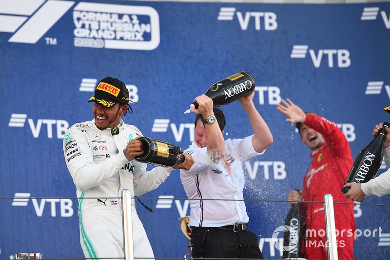 Lewis Hamilton, Mercedes AMG F1, 1st position, Fred Judd, Chief Engineer Trackside, Mercedes AMG F1, and Charles Leclerc, Ferrari, 3rd position, celebrate on the podium