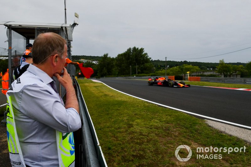 Martin Brundle, Sky Sports F1, watches as Max Verstappen, Red Bull Racing RB15, passes