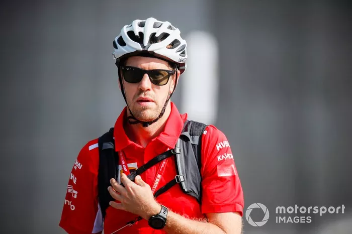 Sebastian Vettel, Ferrari arrives in the paddock on a bike