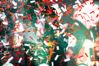 Confetti falls as Max Verstappen, Red Bull Racing, 1st position, celebrates with Champagne on the podium