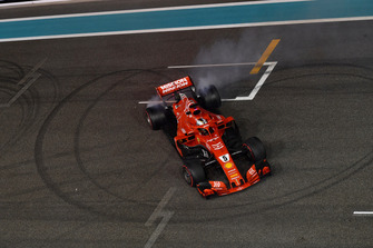 Sebastian Vettel, Ferrari SF71H donuts at the end of the race