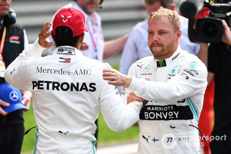 Lewis Hamilton, Mercedes AMG F1, and pole man Valtteri Bottas, Mercedes AMG F1, congratulate each other
