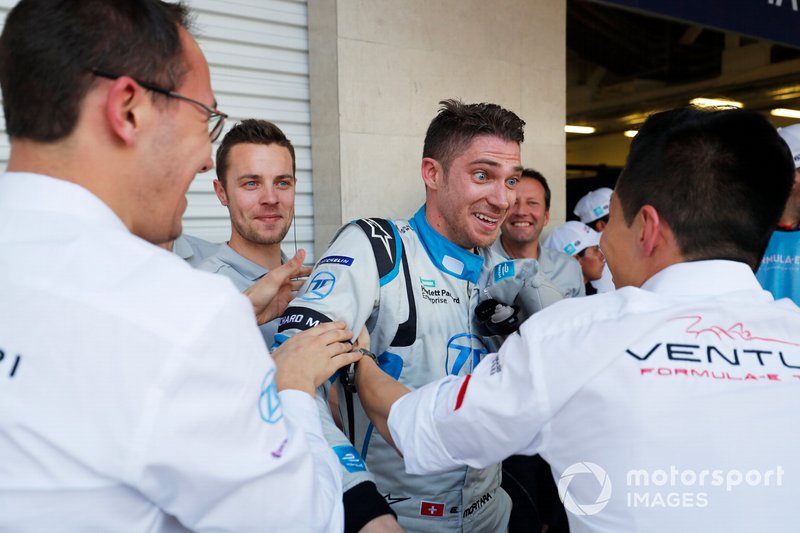 A surprised Edoardo Mortara Venturi Formula E celebrates his 3rd position with his team in parc ferme