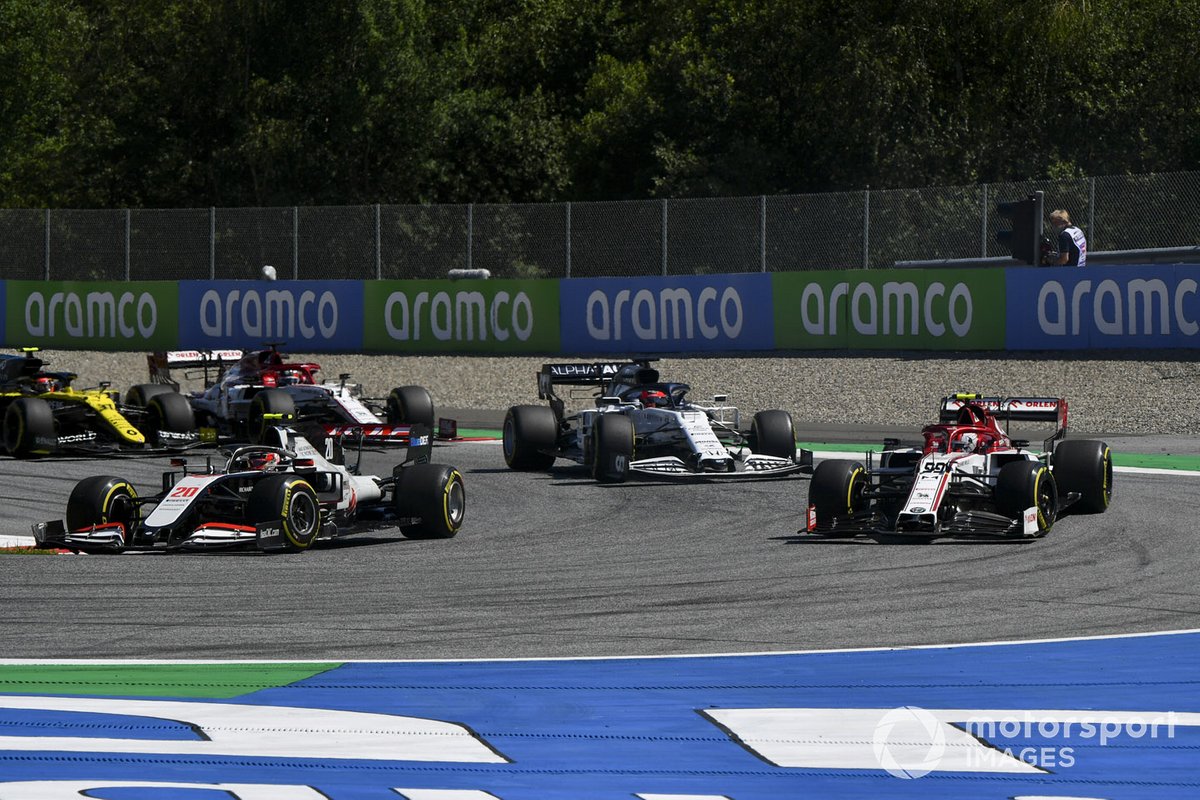 Kevin Magnussen, Haas VF-20, leads Antonio Giovinazzi, Alfa Romeo Racing C39, Daniil Kvyat, AlphaTauri AT01, and Romain Grosjean, Haas VF-20