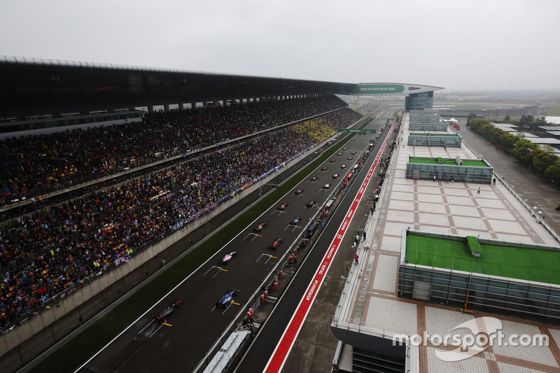 Lewis Hamilton, Mercedes AMG F1 W08, and Sebastian Vettel, Ferrari SF70H, prepare to lead the field away for the start