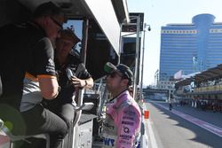 Sergio Perez, Sahara Force India talks, Robert Fearnley, Sahara Force India F1 Team Deputy Team Principal and Otmar Szafnauer, Sahara Force India Formula One Team Chief Operating Officer on the pit wall gantry following his pit stop, a broken front wing