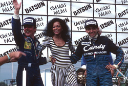 Podium: race winner Michele Alboreto, Tyrell Ford, World Champion Keke Rosberg, Williams Ford