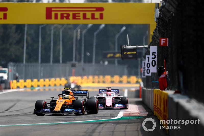 Lando Norris, McLaren MCL34, leads Sergio Perez, Racing Point RP19