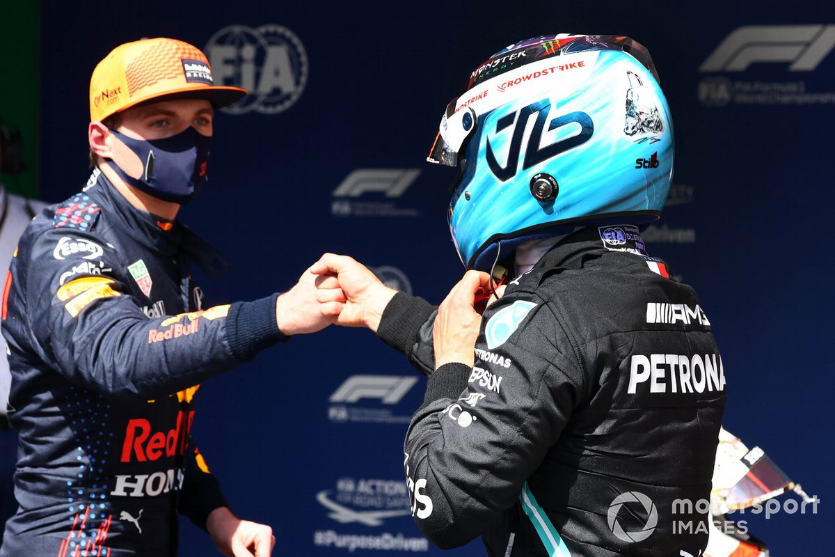 Pole man Valtteri Bottas, Mercedes, celebrates in Parc Ferme with Max Verstappen, Red Bull Racing