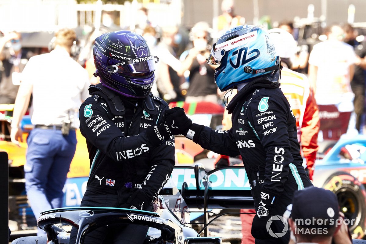 Valtteri Bottas, Mercedes, congratulates Lewis Hamilton, Mercedes, on securing his 100th F1 pole in Parc Ferme