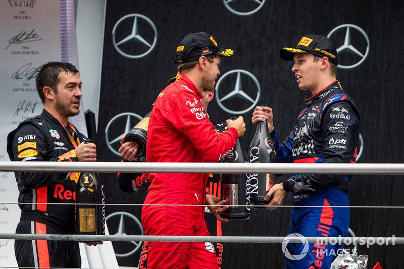 Guillaume Rocquelin, Head of Race Engineering, Red Bull Racing, Sebastian Vettel, Ferrari, 2nd position, and Daniil Kvyat, Toro Rosso, 3rd position, on the podium