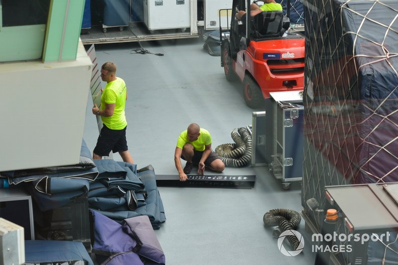 Red Bull Honda team members unpack freight