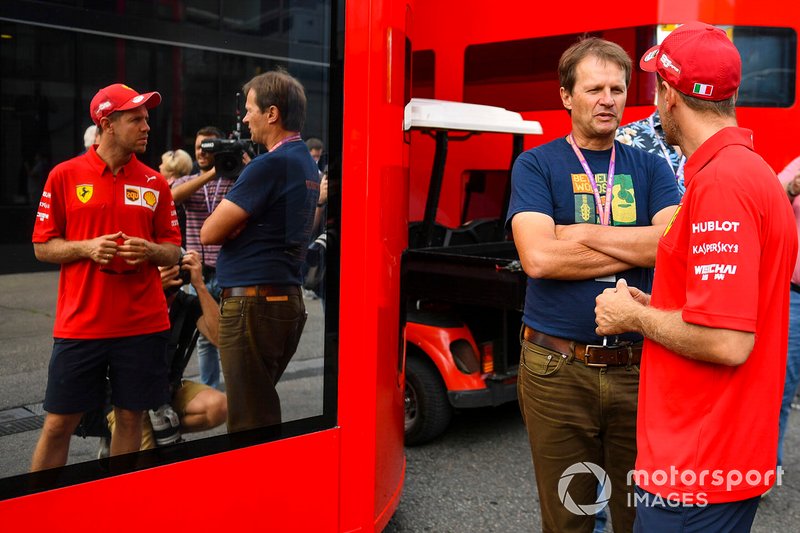 Sebastian Vettel, Ferrari, talks to journalist Michael Schmidt