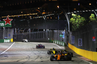 Fernando Alonso, McLaren MCL33, leads Carlos Sainz Jr., Renault Sport F1 Team R.S. 18, and Nico Hulkenberg, Renault Sport F1 Team R.S. 18