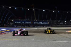 Sergio Perez, Racing Point Force India VJM11 and Carlos Sainz Jr., Renault Sport F1 Team R.S. 18 on the grid