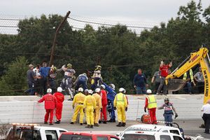 IndyCar officials at the site of the crash